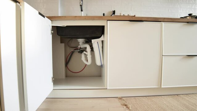 House water filtration system to drinkable condition, reverse osmosis.Installation or replacement filter cartridges of foamed polypropylene, granular, briquettes carbon under kitchen sink with lights.