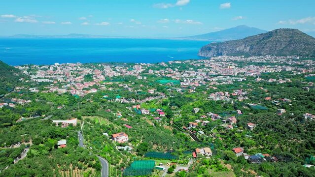 Panoramic drone view of Meta and Sant'Agnello Metropolitan cities of Napoli. Top view of Italian houses and Cities by the Mediterranean Sea on the Amalfi Coast