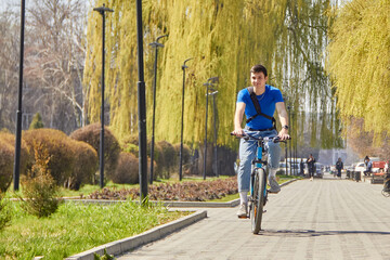 Urban biking teenage boy racing bike in city