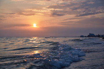 Obraz premium Orange-gold sunset, sky, sunlight, summer mood landscape with sea sunset on beach.