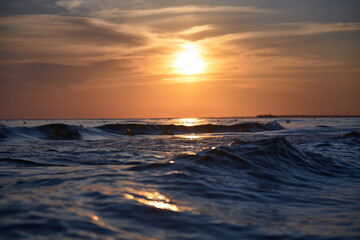 Orange-gold sunset, sky, sunlight, summer mood landscape with sea sunset on beach.