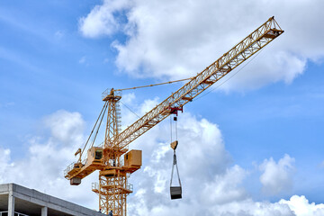 Fototapeta na wymiar construction crane on a blue sky background.