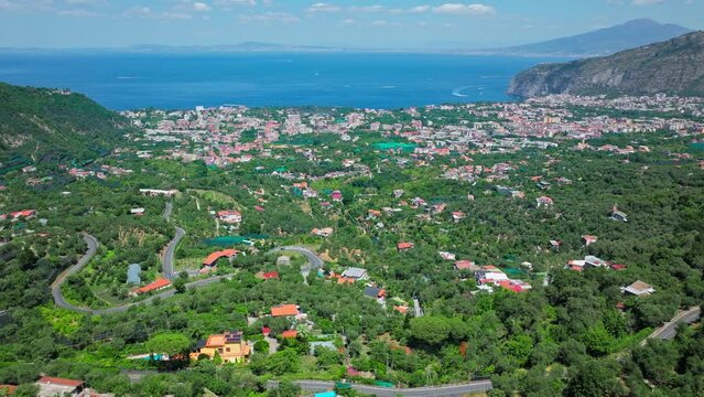 Panoramic drone view of Meta and Sant'Agnello Metropolitan cities of Napoli. Top view of Italian houses and Cities by the Mediterranean Sea on the Amalfi Coast