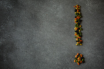 Three coloured sunflower seeds in different shapes and patterns