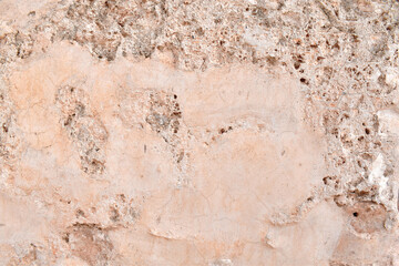 Dirty old ancient cracked cement render wall texture background.  Old and rough concrete wall.