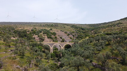 Tatar Bridge - Very old stone arch bridge from Ottoman or even older times about 30 m long with three arches, 2 central piers, completely preserved near Urla, Turkish Aegean Sea