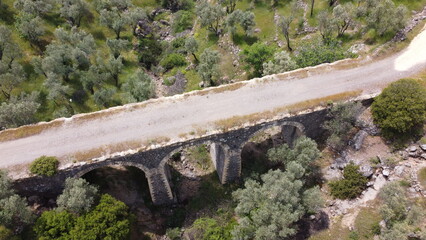 Tatar Bridge - Very old stone arch bridge from Ottoman or even older times about 30 m long with three arches, 2 central piers, completely preserved near Urla, Turkish Aegean Sea