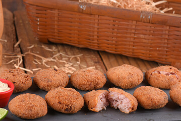 Fried and breaded codfish cake, fish empanadas, codfish cake, Brazilian-style codfish cakes, meat disc