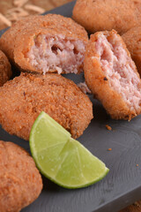 Fried and breaded codfish cake, fish empanadas, codfish cake, Brazilian-style codfish cakes, meat disc