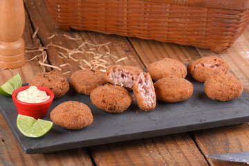 Fried and breaded codfish cake, fish empanadas, codfish cake, Brazilian-style codfish cakes, meat disc