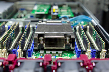 Fototapeta na wymiar Inside view of hardware components in opened multiprocessor server system. Selective focus.