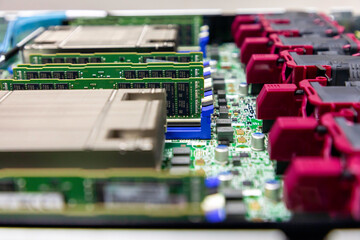 Inside view of hardware components in opened multiprocessor server system. Selective focus.