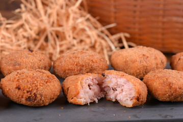 Fried and breaded codfish cake, fish empanadas, codfish cake, Brazilian-style codfish cakes, meat disc