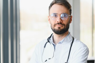 Portrait of young male doctor with stethoscope, close up