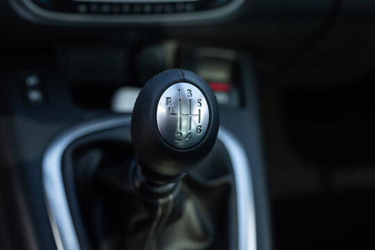 Lever manual transmission six-speed on the car. Gear shift in a car. Modern design manual gear knob lever. 6 speed transmission and reverse shifting position. Chromed handle head