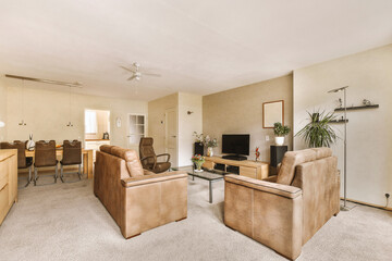 a living room with two couches and a coffee table in the room is very clean, white carpeting