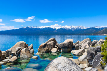 Boulders in Lake Tahoe shoreline, facing Northwest towards Olympic Valley and Granite Chief wilderness on the California side