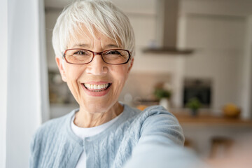 Close up portrait of one senior woman with short hair happy smile