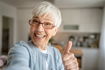 Close up portrait of one senior woman with short hair happy smile