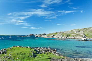 Beach at Fionnphort, Mull with turquoise sea water and blue sky, hebrides, Scotland, copy space - Powered by Adobe