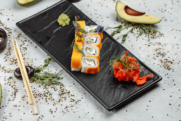 Rainbow Sushi Roll with salmon, eel, tuna, avocado, royal prawn, cream cheese Philadelphia, caviar tobica, chuka. Sushi menu. Japanese food. © Дмитрий Скорина