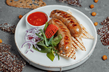 Grilled tasty bratwurst sausages on the plate