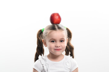 Fototapeta na wymiar Red apple and little girl, portrait of a child on a white background