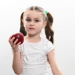Red apple and little girl, portrait of a child on a white background