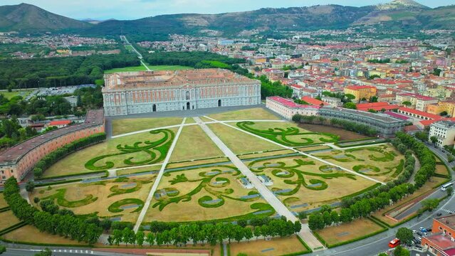 Aerial view of the Royal Palace of Caserta and Palace Gardens in Napoli, Italy. The huge Baroque royal palace in a sprawling fountain-filled park, with a court theatre plus guided tours.