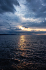 Cloudy Cloudscape during stormy everning on the West Coast of Pacific Ocean. British Columbia, Canada. Sunset Sky