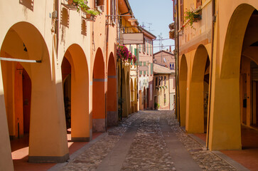 Old street of Dozza with street art.