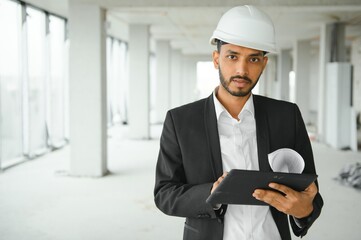 Portrait of a Indian engineer posing at the camera