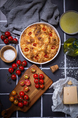 Focaccia with parmesan cheese and sweet grape tomatoes with raw tomatoes grated parmesan cheese and olive oil. 