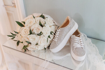 a beautiful and elegant bridal bouquet and comfortable sports shoes for a wedding walk