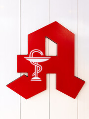 Singen, Germany - May 1, 2023: The red pharmacy A is the identification mark par excellence for public pharmacies in Germany.