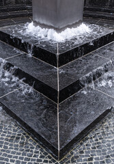 Singen, Germany - May 1, 2023: Contemporary black marble street fountain in Singen