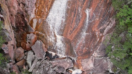Looking vertically at end of waterfall with rushing water, in Chapada Diamantina Bahia Brazil