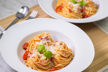 spaghetti with tomatoes, basil and parmesan cheese