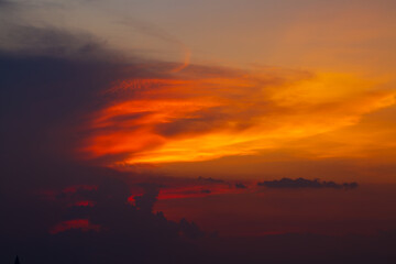 Obraz premium clouds and orange sky,Real amazing panoramic sunrise or sunset sky with gentle colorful clouds. Long panorama, crop it