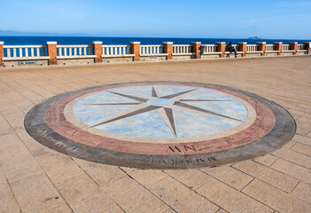 A compass rose or "rose of the winds" on the floor of Piazza Bovio, in Piombino city center, Province of Livorno Tuscany, Italy