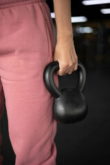 physical activity, hand holding a dumbbell in the form of a ball, exercise in gym, lifting weights for healthy lifestyle