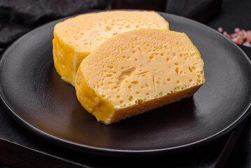 Delicious omelet with milk, spices and herbs cut into large pieces