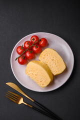 Delicious omelet with milk, spices and herbs cut into large pieces