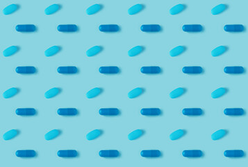 pattern of pills on a blue background. Many pills on a blue background