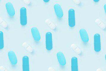 pattern of pills on a blue background. Many pills on a light background