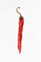 Dried hot red pepper on a white background.