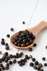 black pepper on a white wooden table