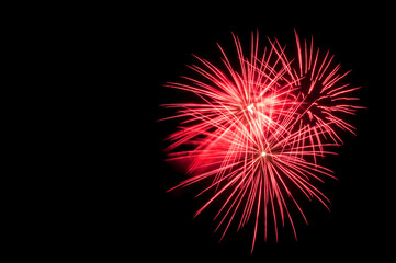 Red fireworks in the night. Black background