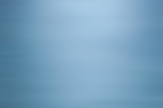blue gradient abstract background with soft sparkle texture.