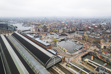 Fototapeta na wymiar Aerial drone view of Amsterdam Centraal Central Railway Station, Netherlands. High quality photo